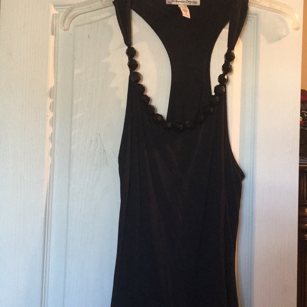 Black sleeveless top with black bead around neck